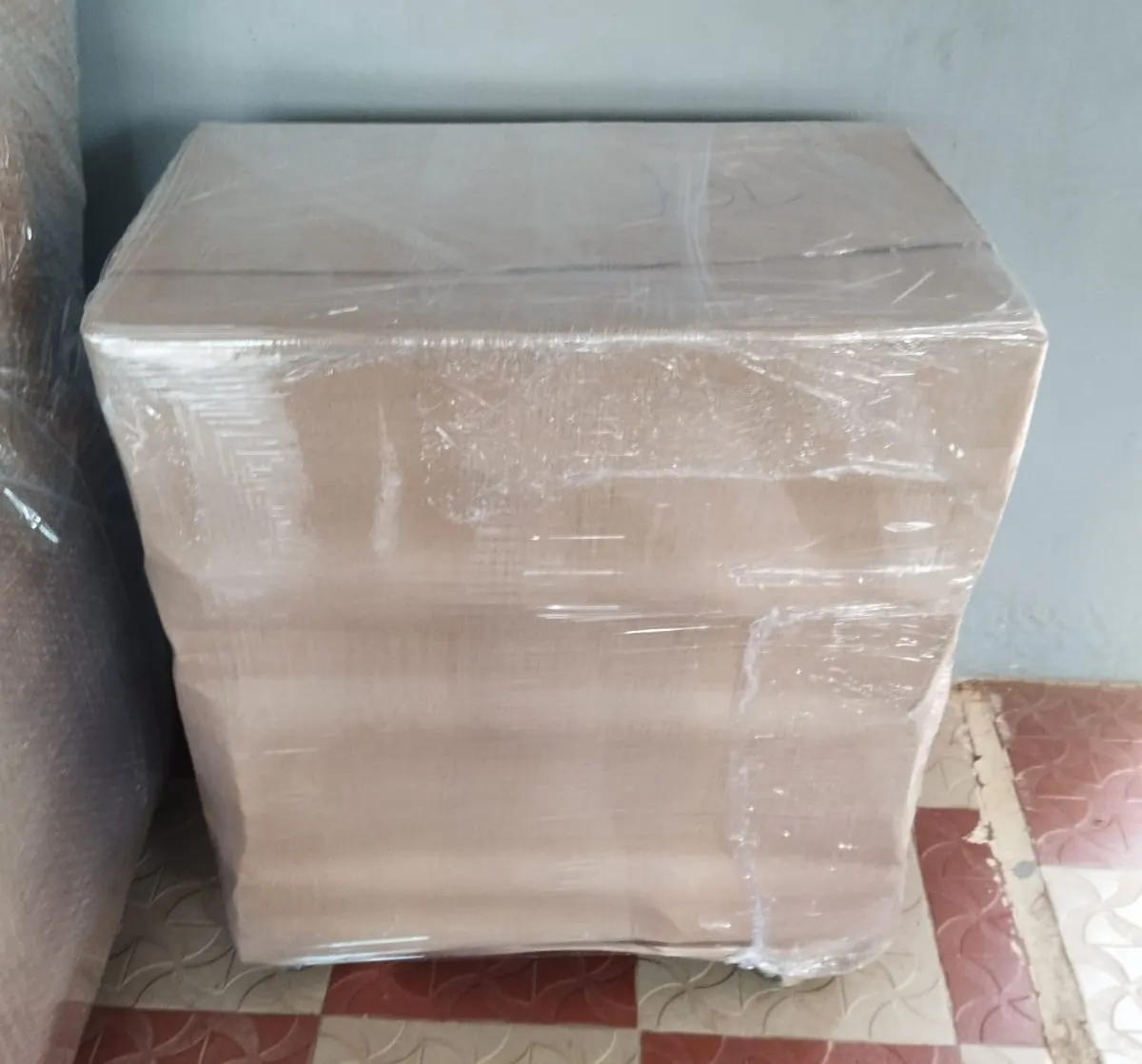 Commercial goods packed in cardboard and stretch film for shifting in Trichy